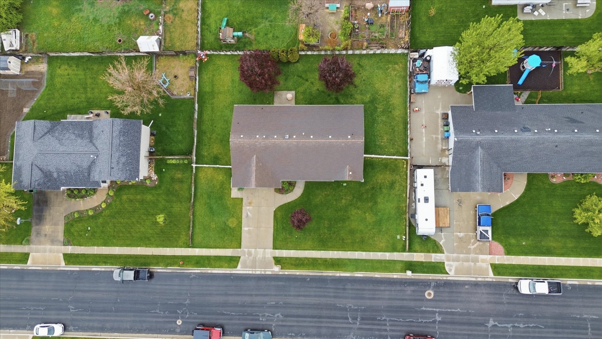 Aerial view of the 0.28-acre lot and quiet Nibley neighborhood